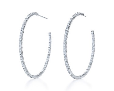 A pair of medium sized white gold and diamond hoop earrings by Kwiat