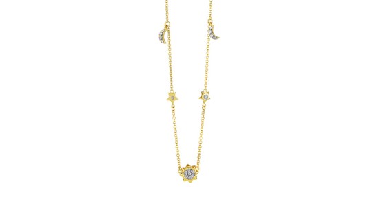 A gold necklace with stationed moon, star, and sun motifs inlaid with diamond accents