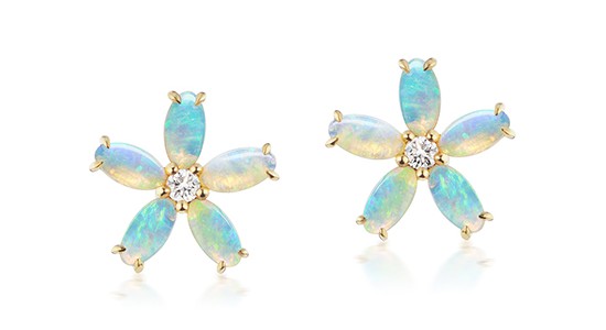 Floral earrings featuring yellow gold, opal petals, and a diamond center