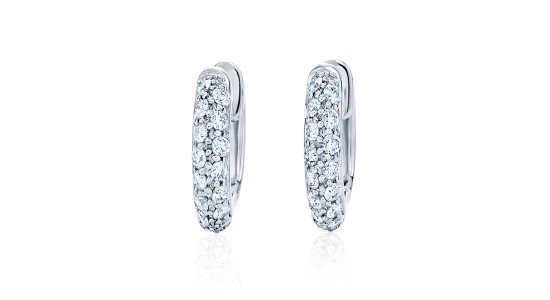 Pair of small, silver huggies earrings dotted with diamonds