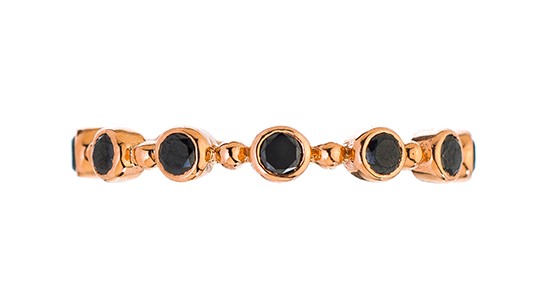 A rose gold stackable fashion ring by Sethi Couture with bezel set black gems, available at Frank Adams Jewelers.