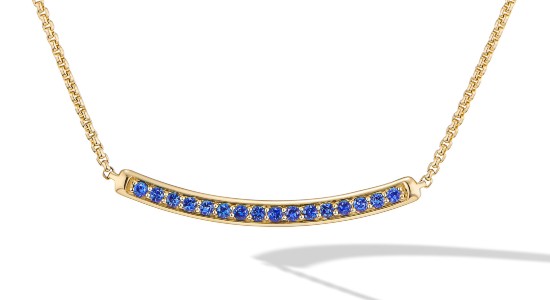 a yellow gold bar necklace set with round cut sapphires