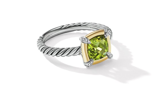 a mixed metal fashion ring featuring a peridot gemstone