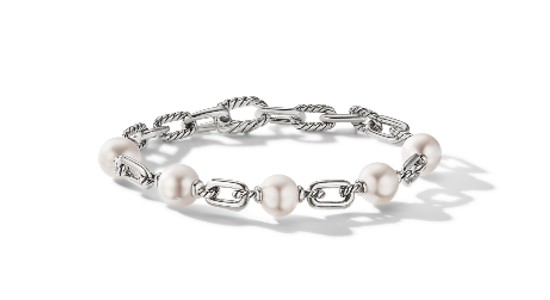 a white gold chain bracelet featuring pearls