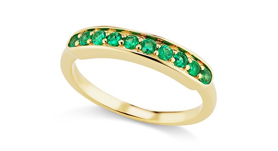 a yellow gold fashion ring featuring round cut emeralds