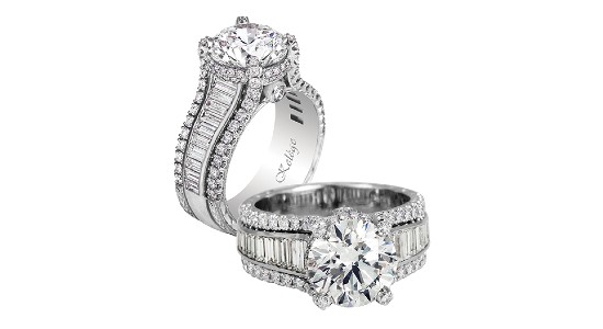 an engagement ring with a round cut center stone and round and baguette cut side stones