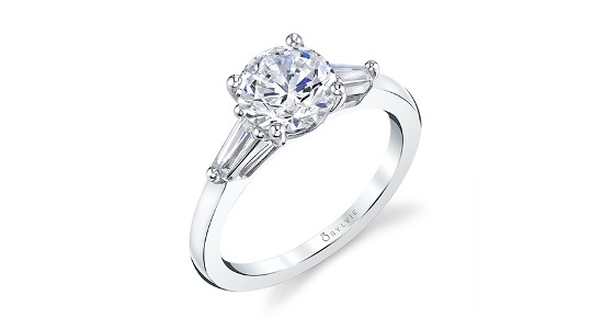 a three stone engagement ring with baguette cut side stones by Sylvie