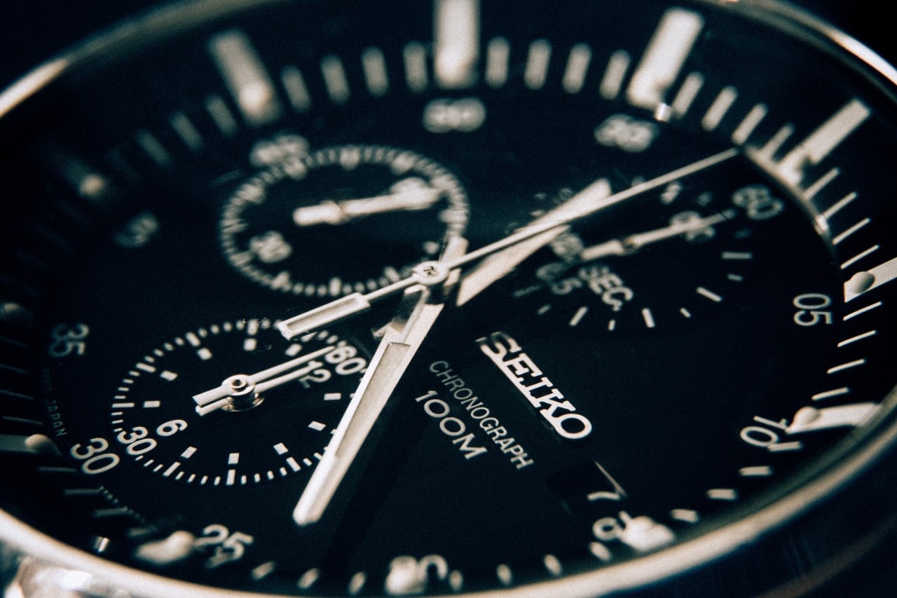 A close up of a black dial of Seiko Chronograph. A close up of a black dial of Seiko Chronograph.